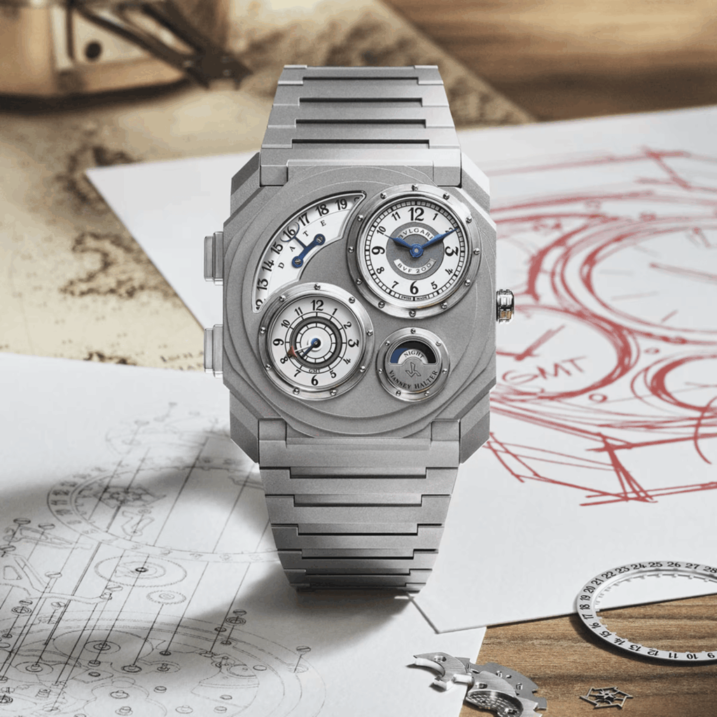Bvlgari Octo Finissimo Dual Time x Vianney Halter en titane posée devant des dessins horlogers