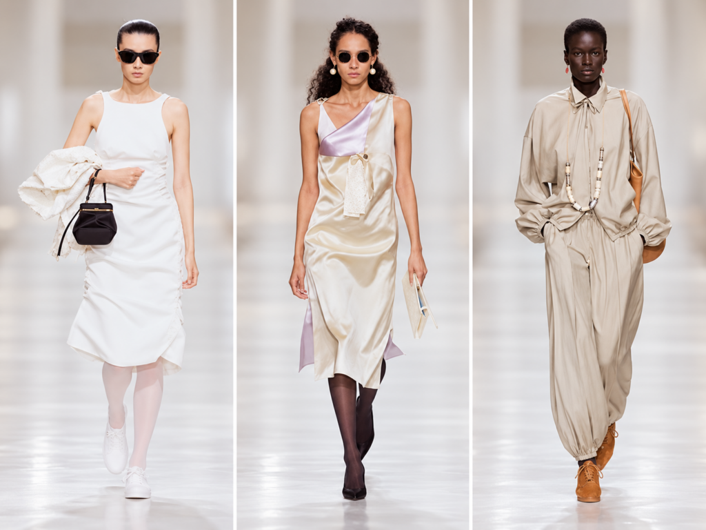Trois silhouettes Celine printemps-été 2027 en blanc, satin ivoire et beige lors du défilé à Paris.